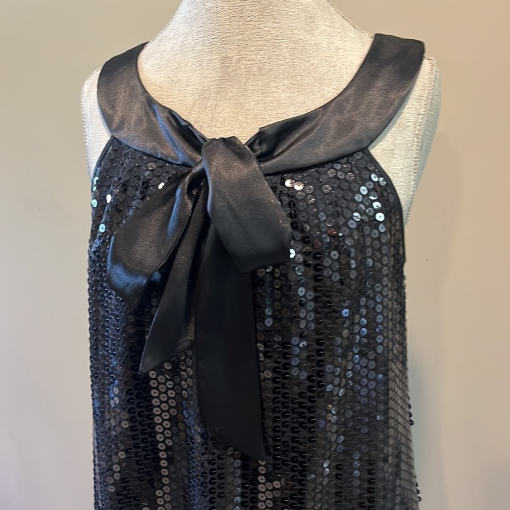 Black sequined Satin neckline with front tie or bow cocktail dress. Fully lined
